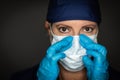 Female Doctor or Nurse Wearing Surgical Gloves Putting On Medical Face Mask Royalty Free Stock Photo