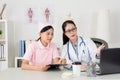Female doctor with nurse working together Royalty Free Stock Photo