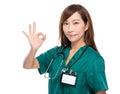 Female doctor with ok sign Royalty Free Stock Photo