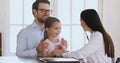 Female paediatrician exam cute little patient girl using stethoscope