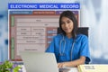 Female doctor with patient blank form of electronic medicale record system on background Royalty Free Stock Photo