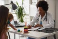 Female doctor pediatrician with baby patient in his office Royalty Free Stock Photo