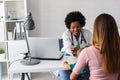 Female doctor pediatrician with baby patient in his office Royalty Free Stock Photo