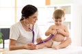 Female doctor pediatrician checking baby patient Royalty Free Stock Photo