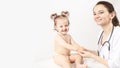 Female doctor pediatrician and patient happy smiling child baby. copy space Royalty Free Stock Photo