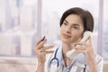 Female doctor on the phone