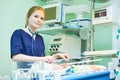 Female doctor portrait in front of intensive care unit for newborn infant baby