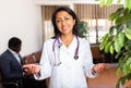 Female doctor posing in clinic