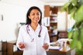 Female doctor posing in clinic