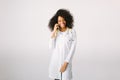 Female doctor Preparation medical equipment. An African American female medical doctor with a stethoscope in hospital on