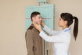 Female doctor preparing the patient for paranasal sinuses