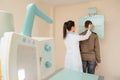 Female doctor preparing the patient for paranasal sinuses x-ray