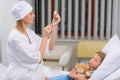 female doctor preparing vaccination