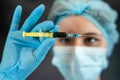 female doctor in protective clothes holding syringe Royalty Free Stock Photo