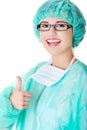 Female doctor in protective mask gesture thumb up Royalty Free Stock Photo