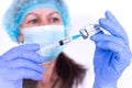 female doctor in protective mask and gloves is typing vaccine into syringe. Close-up. virologist scientist. Prevention