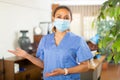 Female doctor in protective mask posing