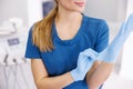 Female doctor putting on protective latex gloves Royalty Free Stock Photo