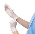 Female doctor putting on rubber gloves against white background, closeup. Royalty Free Stock Photo