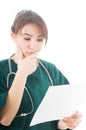 Female doctor reading medical analysis