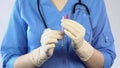 Female doctor in rubber gloves preparing syringe insulin injection, vaccination Royalty Free Stock Photo