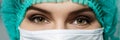 Female doctor's face wearing protective mask Royalty Free Stock Photo