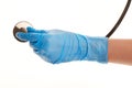 Female doctor's hand in blue sterilized surgical glove with stethoscope