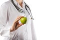 Female doctor's hand holding green apple. Close up Royalty Free Stock Photo