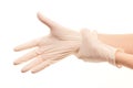 Female doctor's hands putting on white sterilized surgical gloves