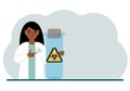 A female doctor or scientist is holding a test tube with a biohazard or virus warning label on it. Biological hazard.