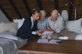 Female doctor and senior couple discussing over medical reports Royalty Free Stock Photo