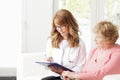 Female doctor with senior patient