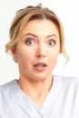 Female doctor shocked. Close up portrait of a young caucasian woman looking surprised with wide eyes stared isolated Royalty Free Stock Photo