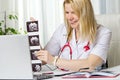Female doctor showing her patient picture of ultrasound image of her baby on the laptop teletreatment