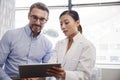 Female Doctor Showing Mature Male Patient Test Results On Digital Tablet In Office Royalty Free Stock Photo