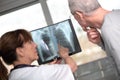 Female doctor showing xray to her patient Royalty Free Stock Photo