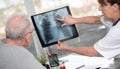 Female doctor showing xray to her patient Royalty Free Stock Photo