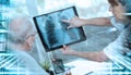 Female doctor showing xray to her patient; light effect; multiple exposure Royalty Free Stock Photo