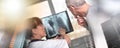 Female doctor showing xray to her patient; multiple exposure Royalty Free Stock Photo