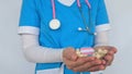 Female doctor shows LGBT pride flag in hand and hospital people figures