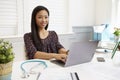 Female Doctor Sitting At Desk Working At Laptop In Office Royalty Free Stock Photo