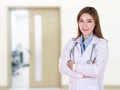 Female doctor smiling with arms crossed Royalty Free Stock Photo