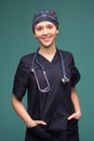 Female doctor smilling on green background. helthcare and medicine concept