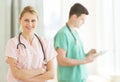 Female Doctor Standing Arms Crossed At Hospital Royalty Free Stock Photo