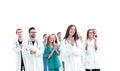 Female doctor standing in front of her applauding colleagues Royalty Free Stock Photo