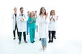 Female doctor standing in front of her applauding colleagues Royalty Free Stock Photo