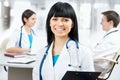 Female doctor standing in frount of his team Royalty Free Stock Photo