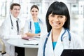 Female doctor standing in frount of his team Royalty Free Stock Photo