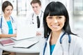 Female doctor standing in frount of his team Royalty Free Stock Photo