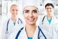 Female doctor standing in frount of his team Royalty Free Stock Photo